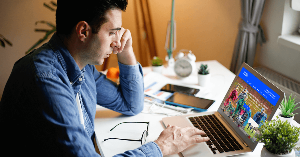 man frustrated while viewing overly crowded web design