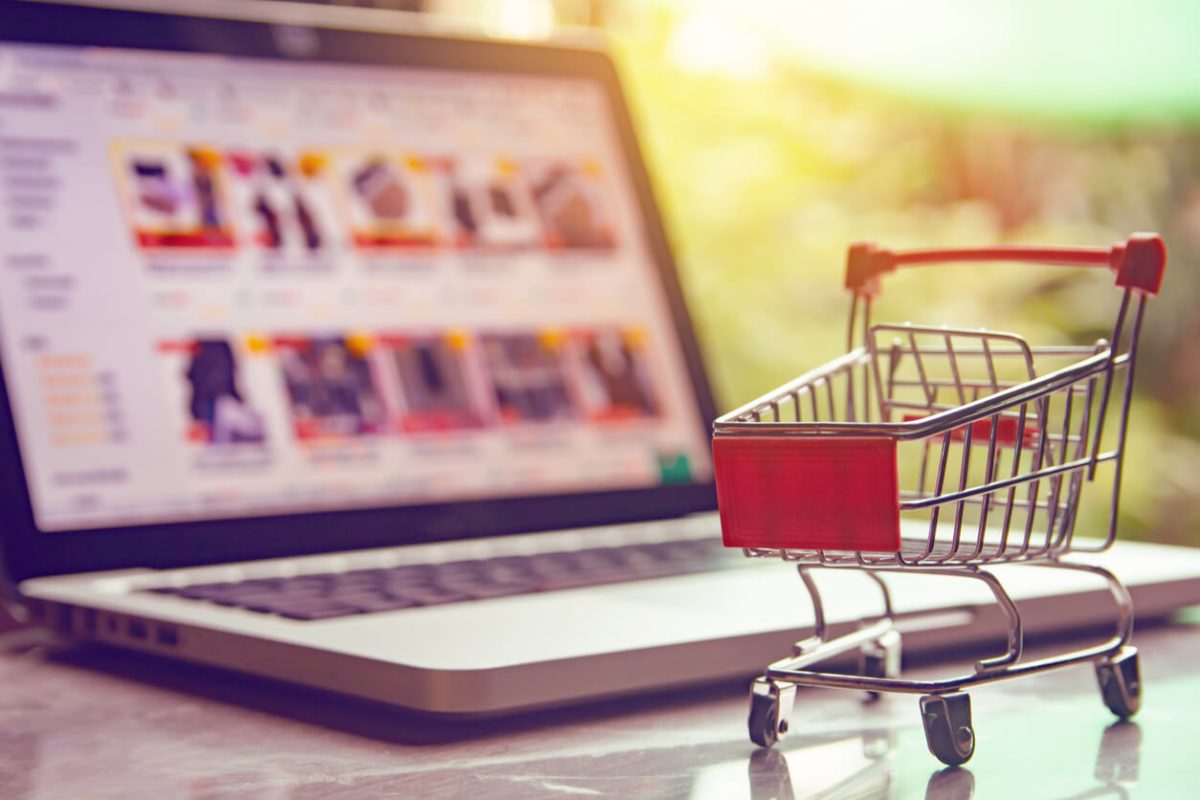 an empty shopping cart with an eCommerce website in the background